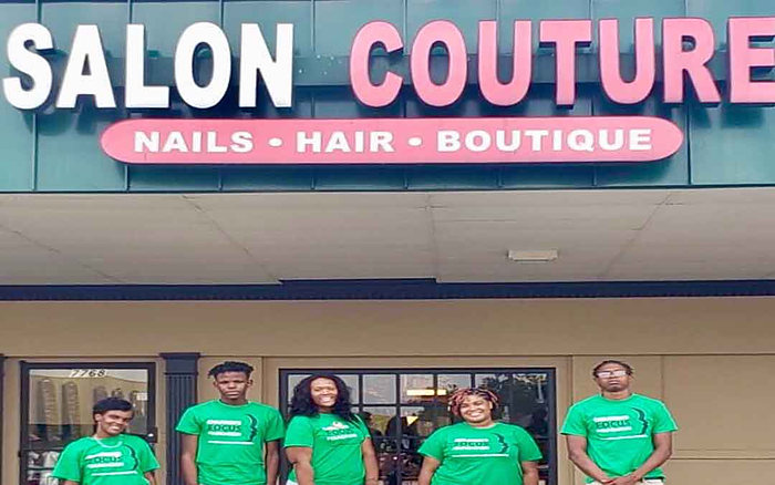 CFF participants outside a partner business in the community