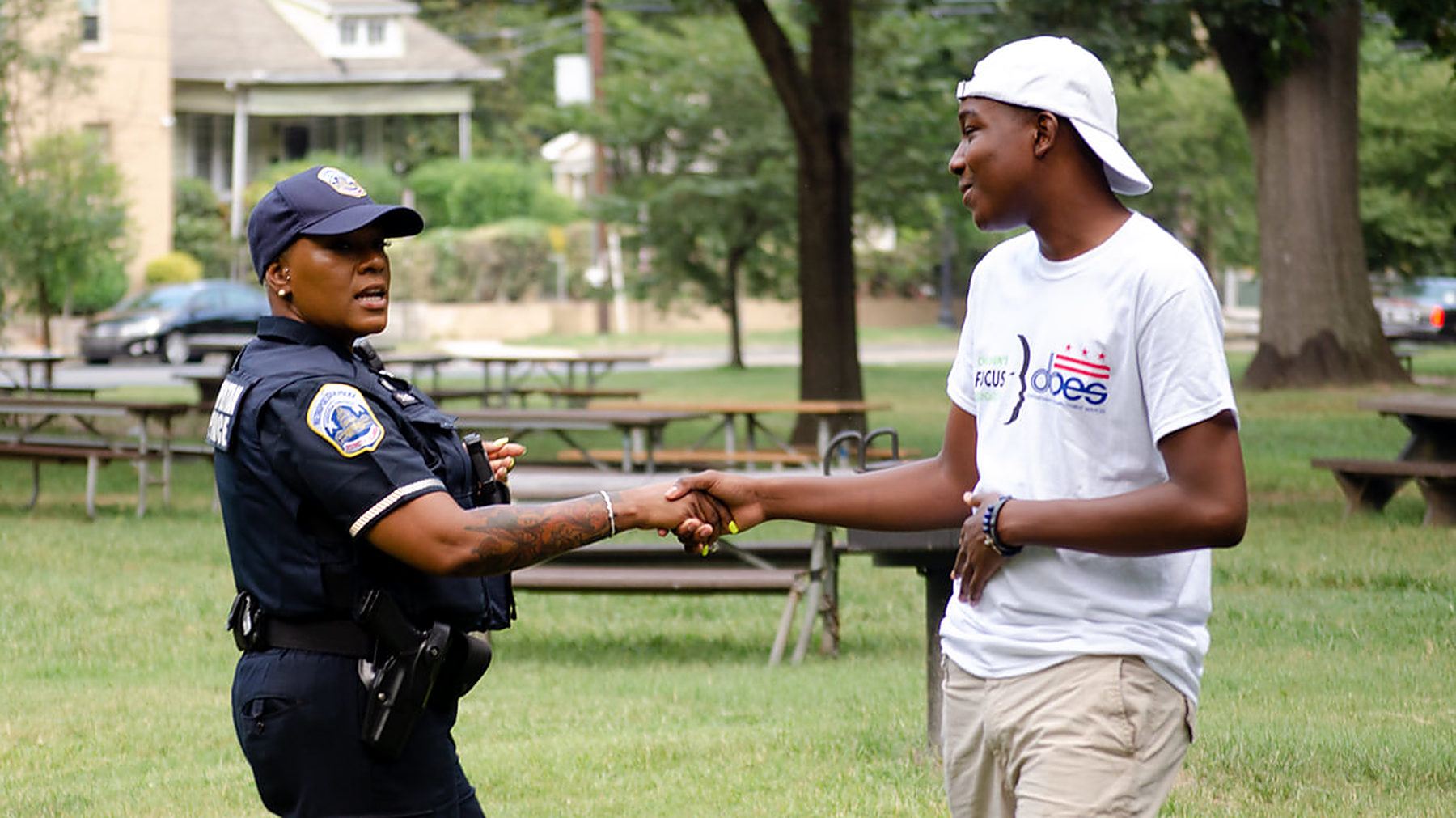 A police officer and a young person in conversation at a CFF event